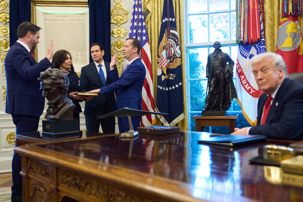 Vice President JD Vance, at left, swears in U.S. Ambassador to India Sergio Gor, with U.S. Attorney for the District of Columbia Jeanine Pirro, and Secretary of State Marco Rubio, and President Donald Trump, at right, in the Oval Office of the White House, Monday, Nov. 10, 2025, in Washington. (AP Photo/Jacquelyn Martin)