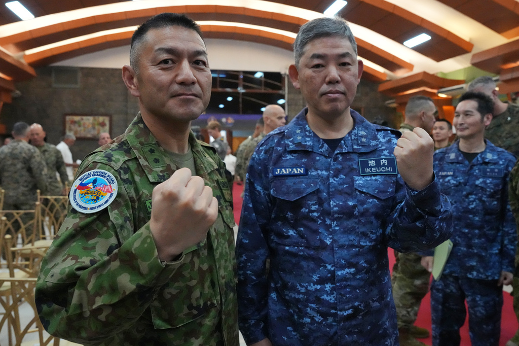 Japan army Maj. Gen. Toshikatsu Musha, left, and Japan navy Rear Admiral Izuru Ikeuchi pose as they participate during the opening ceremonies of the joint military exercise dubbed "Balikatan" or "Shoulder to Shoulder," Monday, April 20, 2026, in Quezon city, Philippines. (AP Photo/Aaron Favila)