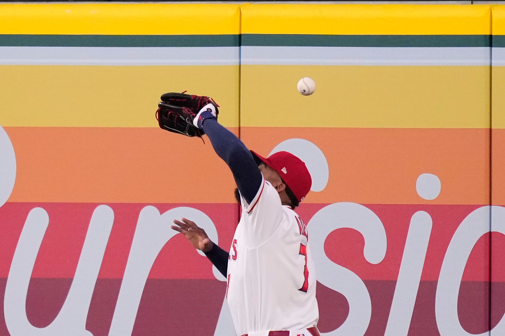 Los Angeles Angels right fielder Jo Adell misplays a ball hit by Colorado Rockies' TJ Rumfield that hit him in the head and then bounced out for a solo home run during the fourth inning of a baseball game Tuesday, June 2, 2026, in Anaheim, Calif. (AP Photo/Mark J. Terrill)