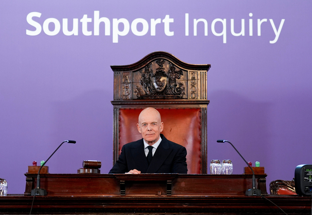 Chair Sir Adrian Fulford sits inside the hearing room, Sunday April 12, 2026, at Liverpool Town Hall ahead of the publication of findings of the inquiry into the three young girls killed in a knife attack at a Taylor Swift-themed holiday club in Southport on July 29, 2024. (Peter Byrne/PA Wire/PA via AP)