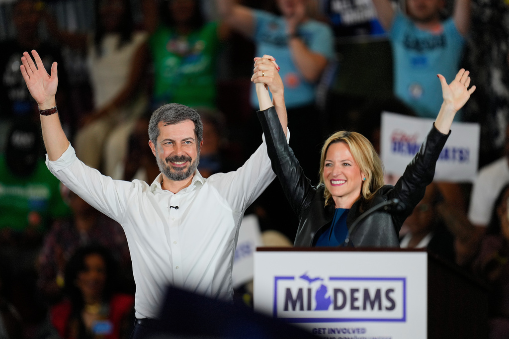 Former Secretary of Transportation Pete Buttigieg, left and Michigan Secretary of State Jocelyn Benson, the Democratic gubernatorial nominee appear at a General Election Kickoff Rally for Michigan Demcrats at Renaissance High School Friday, Aug. 7, 2026, in Detroit. (AP Photo/Paul Sancya)