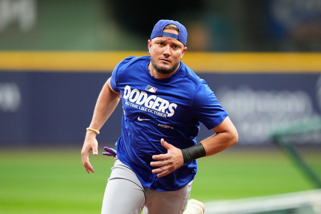 Los Angeles Dodgers' Miguel Rojas works out ahead of Game 1 of baseball's National League Championship Series between the Milwaukee Brewers and the Los Angeles Dodgers, Saturday, Oct. 10, 2026, in Milwaukee. (AP Photo/Kyla Wolf)