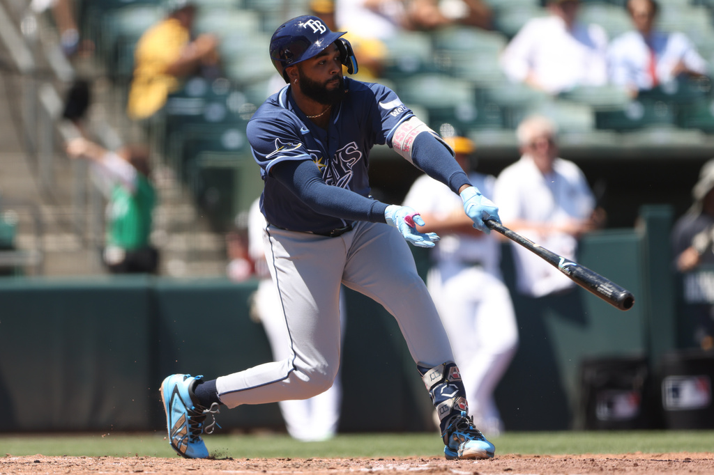 Tampa Bay Rays' Junior Caminero hits an RBI single during the fourth inning of a baseball game against the Athletics Wednesday, Aug. 12, 2026, in West Sacramento, Calif. (AP Photo/Scott Marshall)