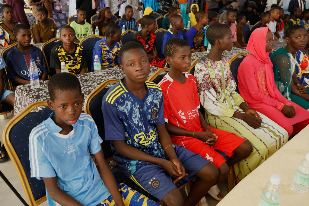 Freed students of the St. Mary's Catholic School in the Papiri community upon arrival at the government house in Minna, Nigeria, Monday, Dec. 8, 2025. (AP Photo)