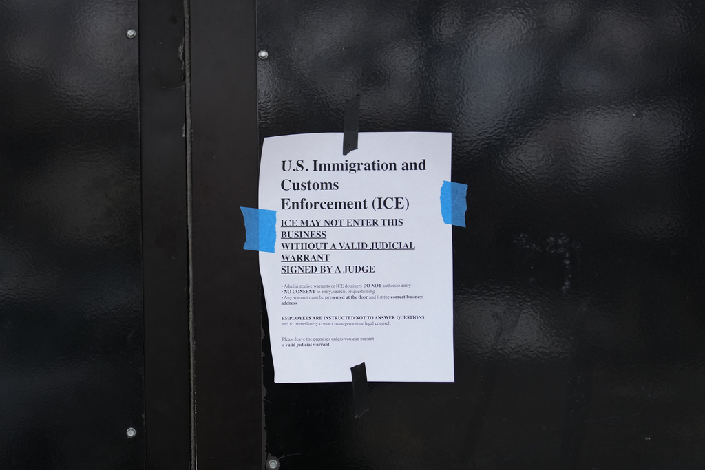 FILE - A sign is taped to the outside of the 24 Somali Mall in Minneapolis, Jan. 15, 2026. (AP Photo/Abbie Parr, File)