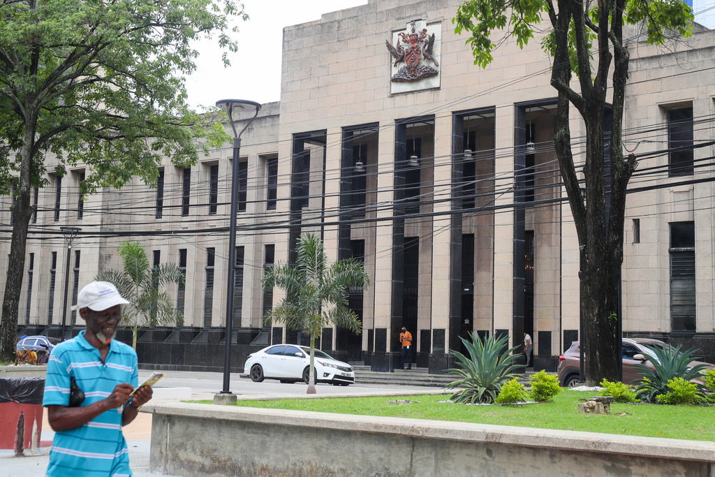 FILE - The country's coat of arms is displayed on the facade of a government building in Port-of-Spain, Trinidad and Tobago, Aug. 20, 2024. (AP Photo/Ash Allen, File)