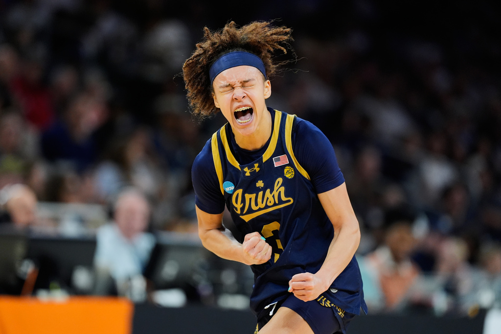 FILE - Notre Dame guard Hannah Hidalgo reacts against the UConn during the first half in the Elite Eight of the NCAA college basketball tournament, March 29, 2026, in Fort Worth, Texas. (AP Photo/Tony Gutierrez, File)
