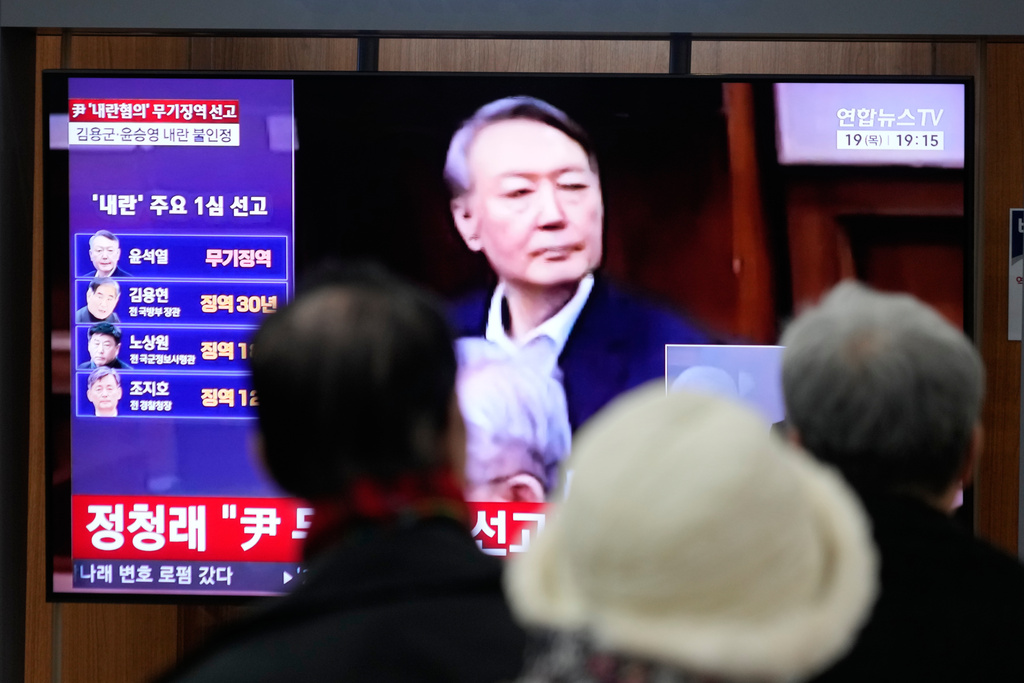 A TV screen shows an image of former South Korea President Yoon Suk Yeol during a news program at the Seoul Railway Station in Seoul, South Korea, Thursday, Feb. 19, 2026. (AP Photo/Ahn Young-joon)