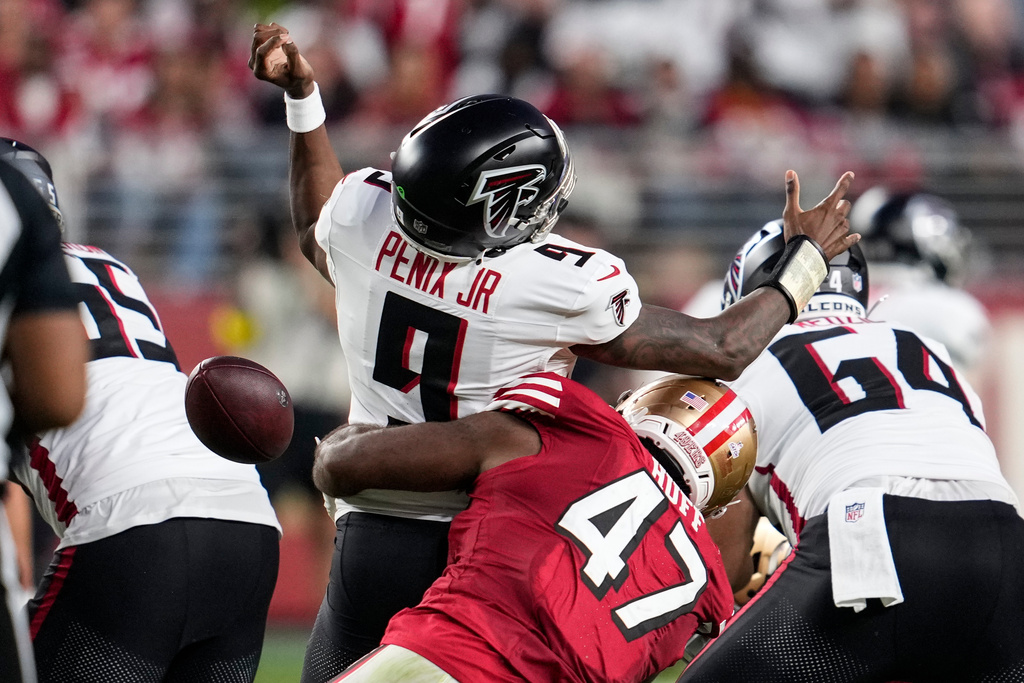 San Francisco 49ers defensive end Bryce Huff (47) forces a fumble against Atlanta Falcons quarterback Michael Penix Jr. (9) in the first half of an NFL football game, Sunday, Oct. 19, 2025, in Santa Clara, Calif. (AP Photo/Godofredo A. Vásquez)