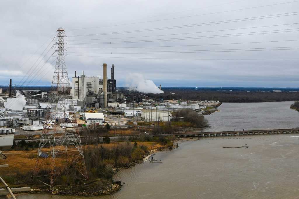 FILE - Industrial development is seen along the Mobile River near Mobile, Ala., on Jan. 29, 2019. (AP Photo/Julie Bennett, File)