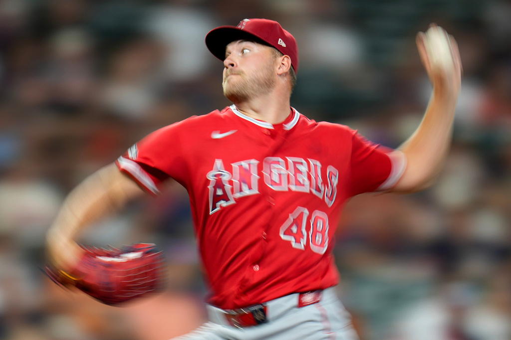 Los Angeles Angels starting pitcher Reid Detmers throws against the Houston Astros during the third inning of a baseball game Saturday, March 28, 2026, in Houston. (AP Photo/Eric Christian Smith)