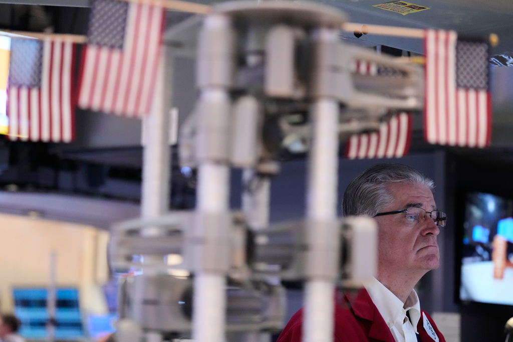 Daniel Kryger works on the floor at the New York Stock Exchange in New York, Monday, April 13, 2026. (AP Photo/Seth Wenig)
