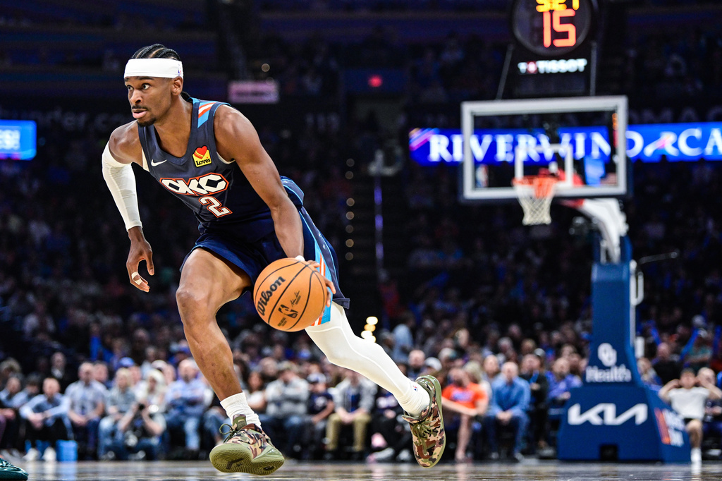Oklahoma City Thunder guard Shai Gilgeous-Alexander (2) drives the ball during the first half of an NBA basketball game against the Chicago Bulls Friday, March. 27, 2026, in Oklahoma City. (AP Photo/Gerald Leong)