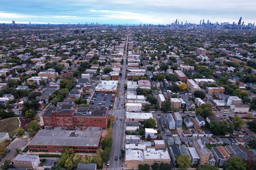 The brick buildings of Funston Elementary School, left, stand in Chicago's Logan Square neighborhood, with downtown Chicago in the background, Wednesday, Oct. 15, 2025. (AP Photo/Rebecca Blackwell) The brick buildings of Funston Elementary School, left, stand in Chicago's Logan Square neighborhood, with downtown Chicago in the background, Wednesday, Oct. 15, 2025. (AP Photo/Rebecca Blackwell)