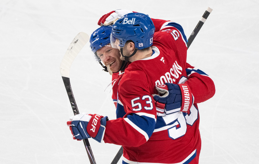 Montreal Canadiens' Noah Dobson (53) celebrates his goal over Florida Panthers with teammate Mike Matheson (8) during the first period of an NHL hockey game in Montreal, Thursday, Jan. 8, 2026. (Christinne Muschi/The Canadian Press via AP)