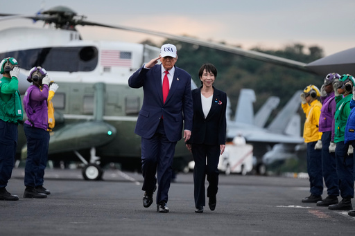 President Donald Trump and Japanese Prime Minister Sanae Takaichi walk on the USS George Washington, an aircraft carrier docked at a U.S. naval base, before speaking to members of the military, in Yokosuka, south of Tokyo, Tuesday, Oct. 28, 2025. (AP Photo/Mark Schiefelbein) President Donald Trump and Japanese Prime Minister Sanae Takaichi walk on the USS George Washington, an aircraft carrier docked at a U.S. naval base, before speaking to members of the military, in Yokosuka, south of Tokyo, Tuesday, Oct. 28, 2025. (AP Photo/Mark Schiefelbein)