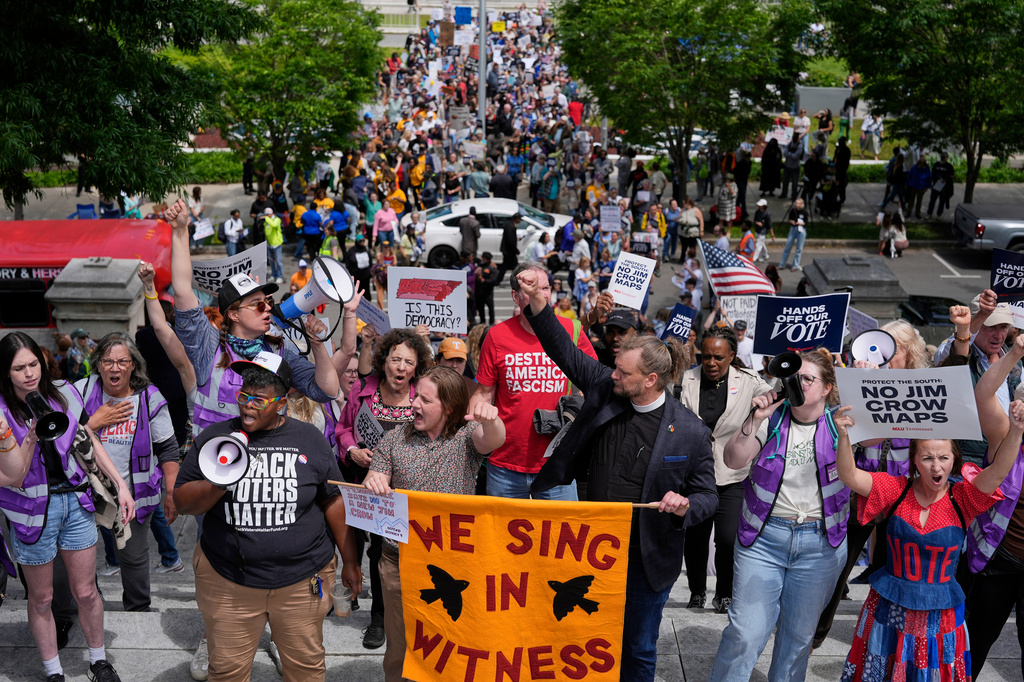 Protesters march to the Capitol before a special session of the state legislature to redraw U.S. Congressional voting maps in Nashville, Tenn., Tuesday, May 5, 2026. (AP Photo/George Walker IV)