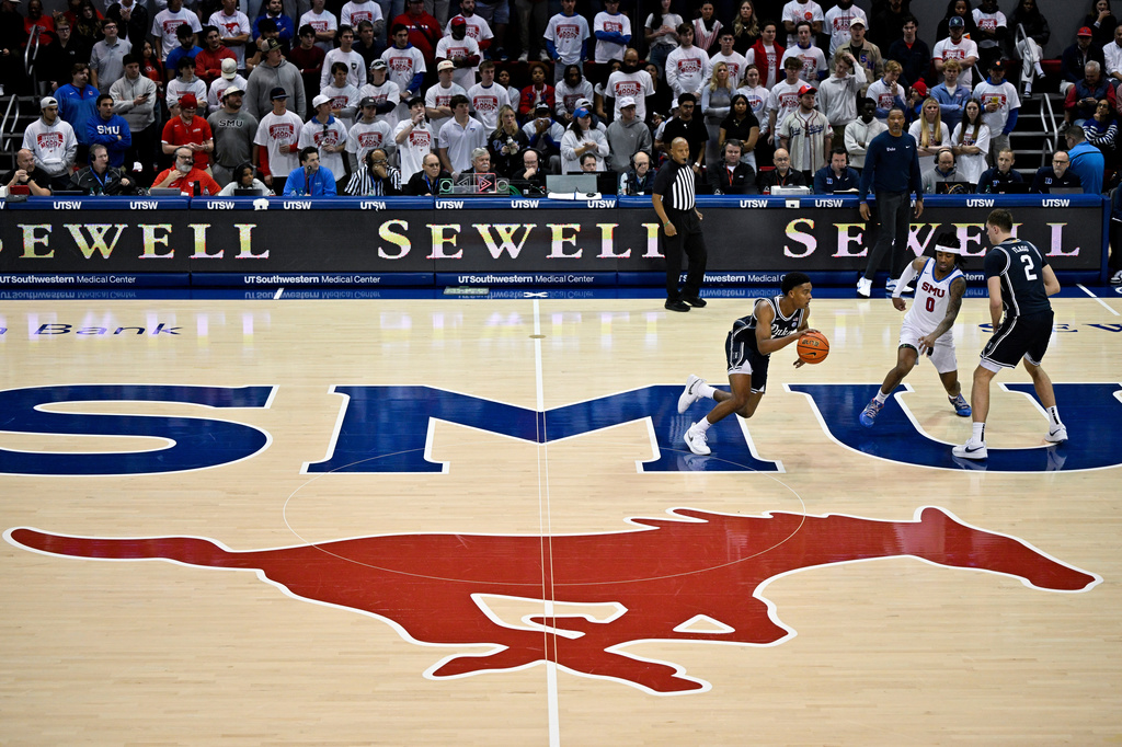 FILE - Duke guard Caleb Foster (1) brings the ball up court past the SMU mid court logo during an NCAA college basketball game, Saturday, Jan 4, 2025, in Dallas. (AP Photo/Jerome Miron, File)
