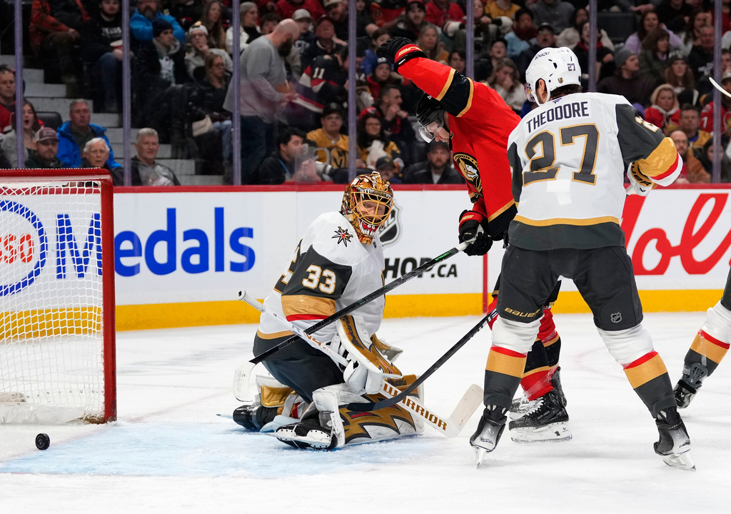 Ottawa Senators' Brady Tkachuk (7) reacts as the shot of Jordan Spence (10), not shown, goes in the net past Vegas Golden Knights goaltender Adin Hill (33) during the second period of an NHL hockey game in Ottawa, Sunday, Jan. 25, 2026. (Justin Tang/The Canadian Press via AP)