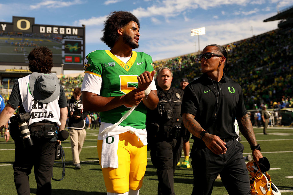 Oregon quarterback Dante Moore (5) walks off the field after the second half of an NCAA college football game, Saturday, Sept. 5, 2026, in Eugene, Ore. (AP Photo/Lydia Ely)