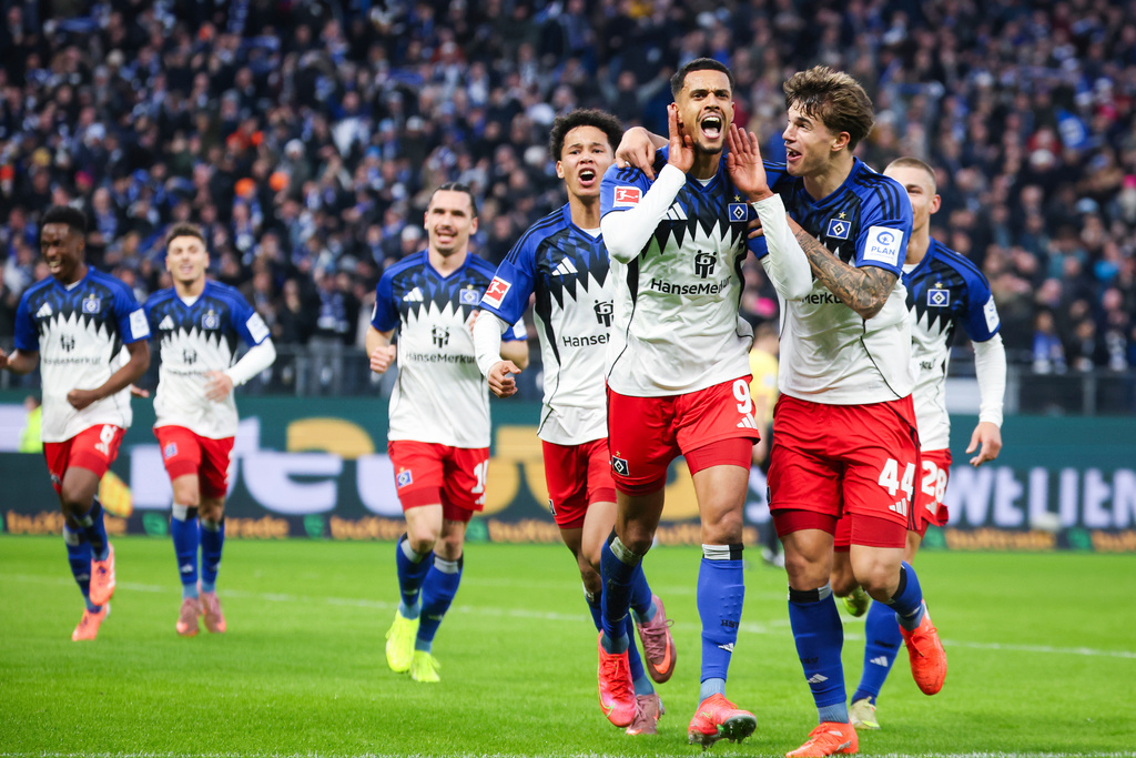 Hamburger's Robert Glatzel celebrates scoring his side's first goal of the game during the German Bundesliga soccer match between Hamburger SV and VfB Stuttgart in Hamburg, Germany, Sunday, Nov. 30, 2025. (Christian Charisius/dpa via AP)