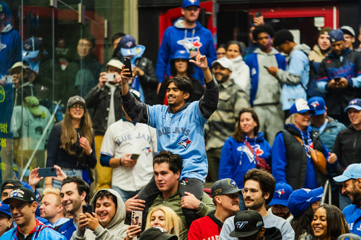 Toronto Blue Jays fans celebrate after the team beat the Seattle Mariners to win the American League Championship Series in Toronto, Monday, Oct. 20, 2025. (Laura Proctor/The Canadian Press via AP) Toronto Blue Jays fans celebrate after the team beat the Seattle Mariners to win the American League Championship Series in Toronto, Monday, Oct. 20, 2025. (Laura Proctor/The Canadian Press via AP)