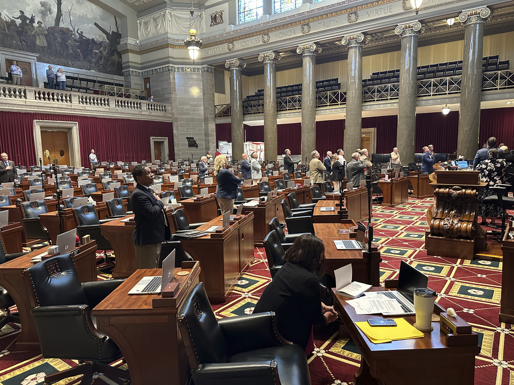 Missouri lawmakers recite the Pledge of Allegiance as a special legislative session gets underway on Wednesday, Sept. 3, 2025, at the state Capitol in Jefferson City, Mo. (AP Photo/David A. Lieb)