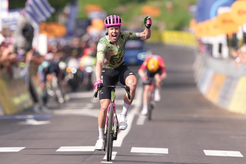 Denmark's Michael Valgren celebrates winning the 17th stage of the Giro d'Italia cycling race from Cassano D'Adda to Andalo, Italy, Wednesday, May 27, 2026. (Gianmattia D'Albertoi/LaPresse via AP)