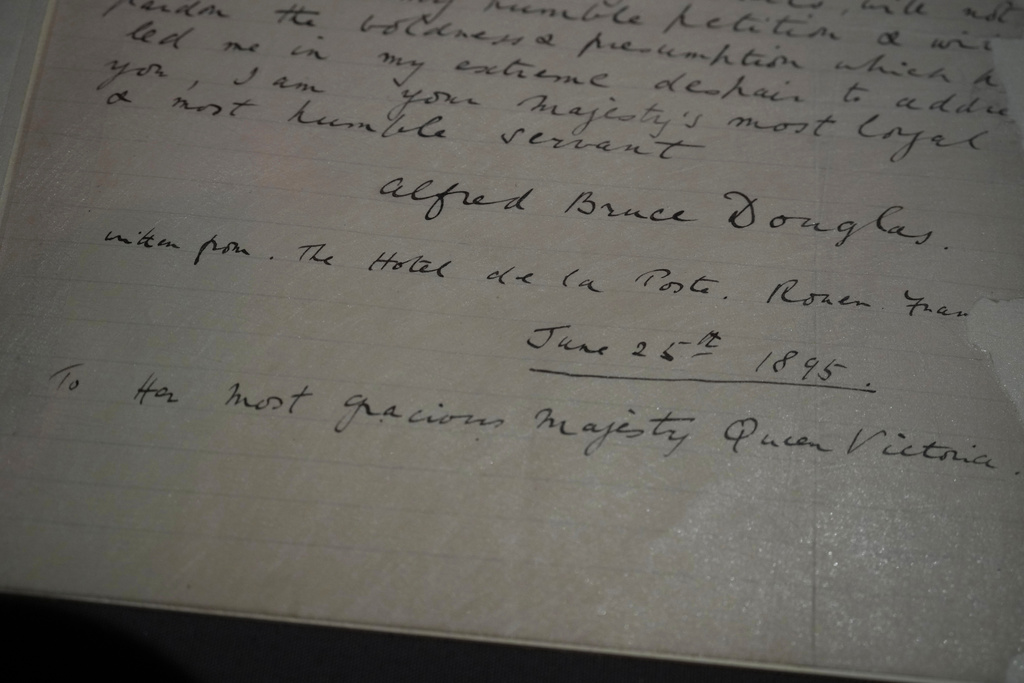 A letter written by Lord Alfred Douglas to Britain's Queen Victoria, petitioning for the release of Oscar Wilde from prison on display during a press preview of an exhibition entitled Love Letters at the National Archives in London, Wednesday, Jan. 21, 2026, Wilde was imprisoned in 1895 for gross indecency. (AP Photo/Alastair Grant)