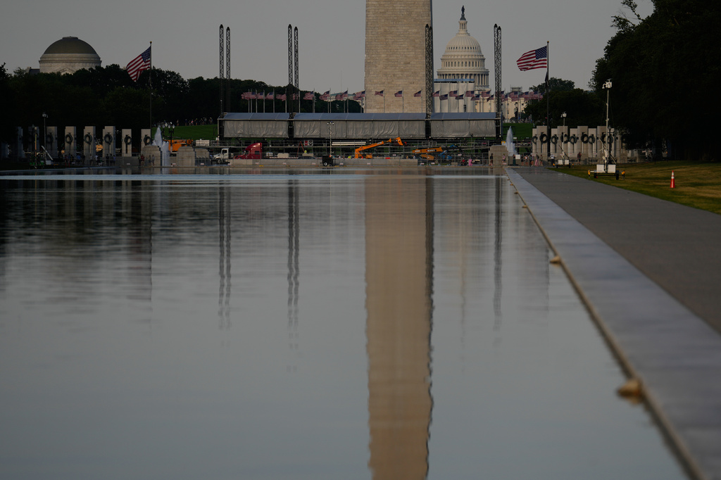 The U.S. Capitol and the Washington Monument are reflected in the Lincoln Memorial Reflecting Pool Thursday, June 25, 2026, in Washington. (AP Photo/Carolyn Kaster)