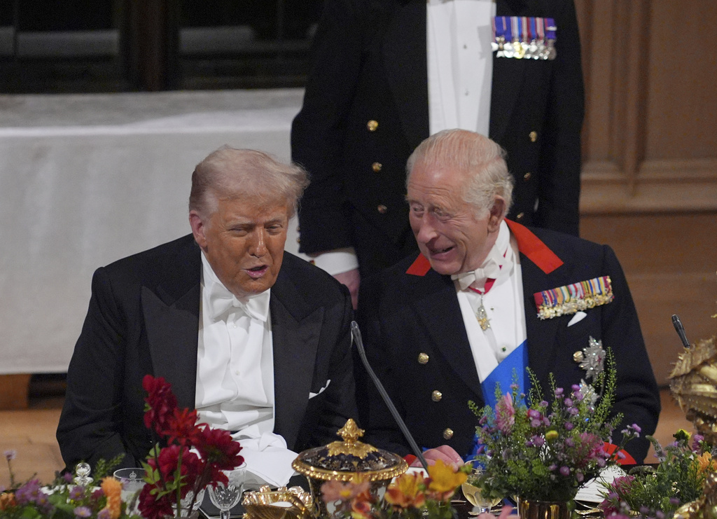 U.S. President Donald Trump, left, and Britain's King Charles speak during the State Banquet in Windsor Castle, England, on day one of U.S. President Donald Trump and First Lady Melania Trump's second state visit to the UK, Wednesday Sept. 17, 2025. (Yui Mok/PA via AP, Pool Photo via AP)