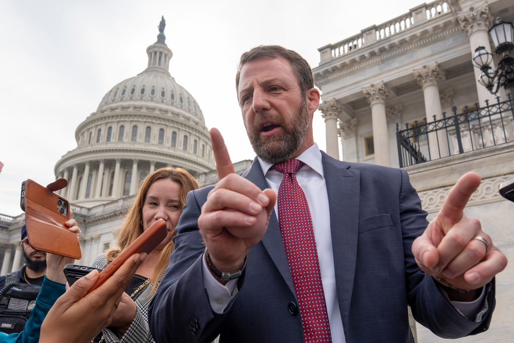 FILE - Sen. Markwayne Mullin, R-Okla., speaks with reporters on the steps at the Capitol in Washington, March 5, 2026. (AP Photo/J. Scott Applewhite, File)