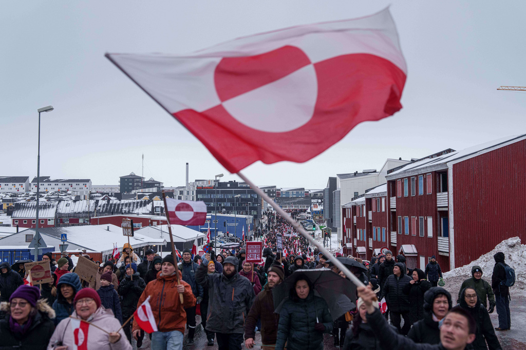 FILE - A crowd walks to the US consulate to protest against Trump's policy towards Greenland in Nuuk, Greenland, Jan. 17, 2026. (AP Photo/Evgeniy Maloletka, File)