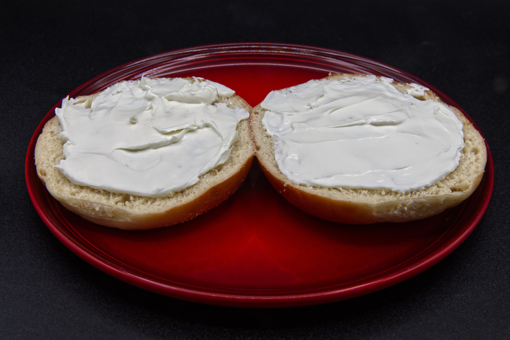 A plain bagel with cream cheese is photographed in Phoenix, Ariz., Monday, July 20, 2026. (AP Photo/Dario Lopez-Mills)