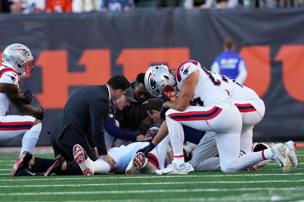 New England Patriots offensive tackle Will Campbell, center, lies on the field after getting injured during the second half of an NFL football game against the Cincinnati Bengals, Sunday, Nov. 23, 2025, in Cincinnati. (AP Photo/Carolyn Kaster)