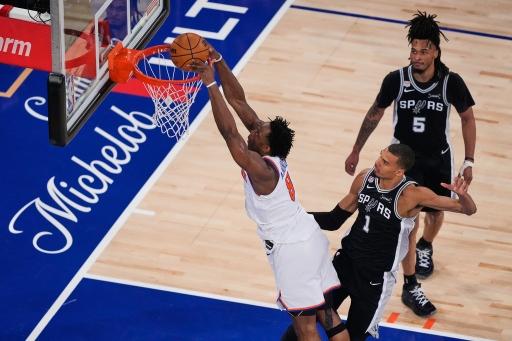 New York Knicks forward Og Anunoby (8) shoots during Game 3 of the NBA Finals basketball series against the San Antonio Spurs, Monday, June 8, 2026, in New York. (AP Photo/Yuki Iwamura)