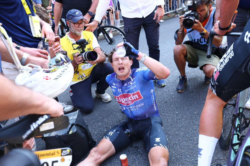 Belgium's Jasper Philipsen cools off after winning the seventeenth stage of the Tour de France cycling race, with start in Chambery and finish in Voiron France, Wednesday, July 22, 2026. (Gonzalo Fuentes/Pool Photo via AP)