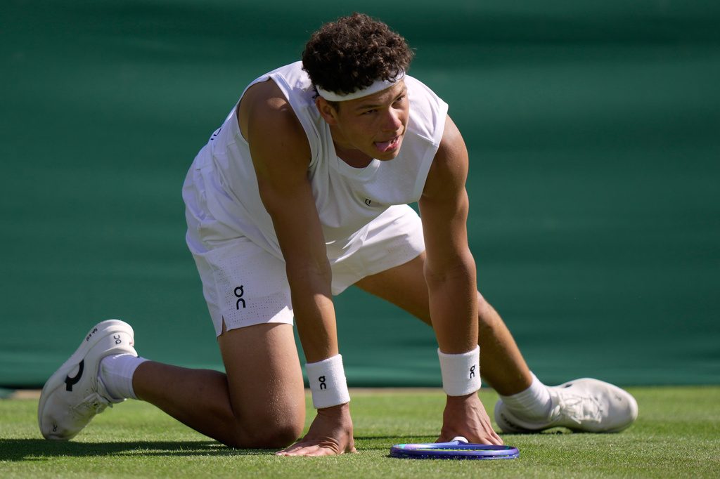 Ben Shelton of the United States reacts as he plays Otto Virtanen of Finland during their men's singles match at the Wimbledon Tennis Championships in London, Tuesday, June 30, 2026.(AP Photo/Brian Inganga)
