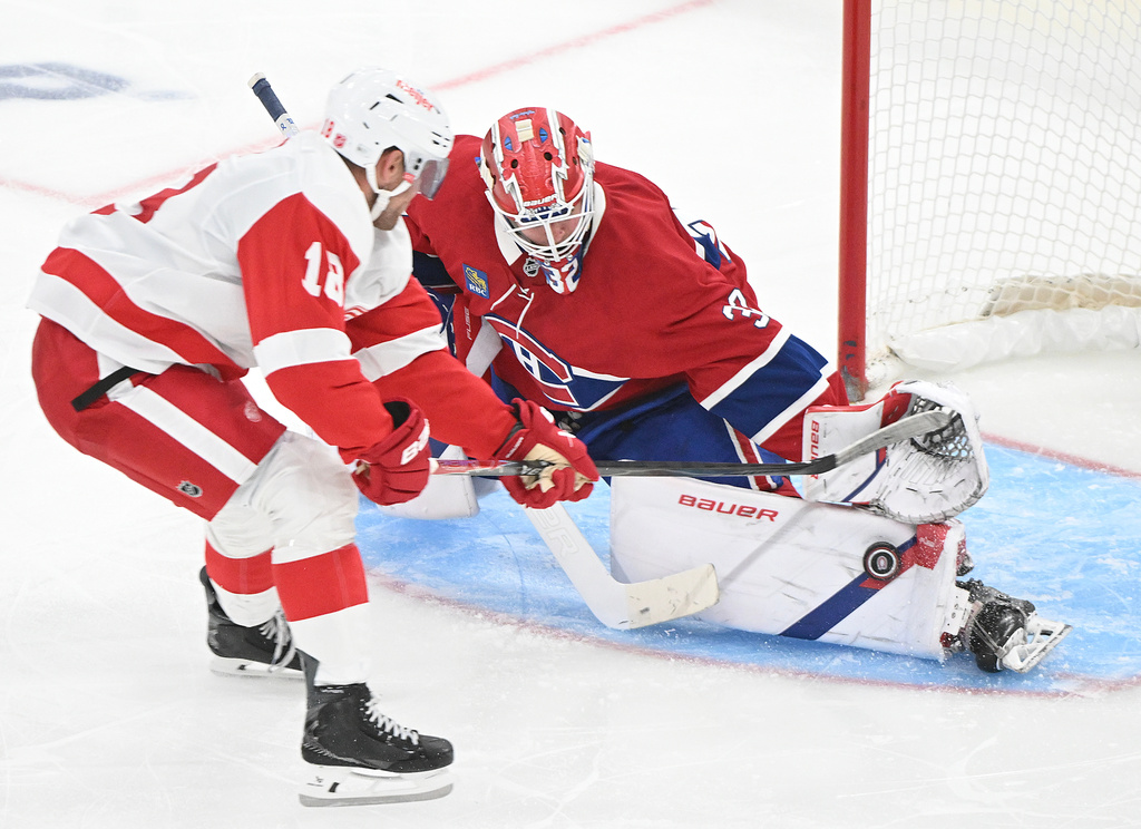 Montreal Canadiens goaltender Jacob Fowler (32) stops Detroit Red Wings' Andrew Copp (18) during third period of an NHL hockey game in Montreal on Saturday, Oct. 10, 2026. (Graham Hughes/The Canadian Press via AP)