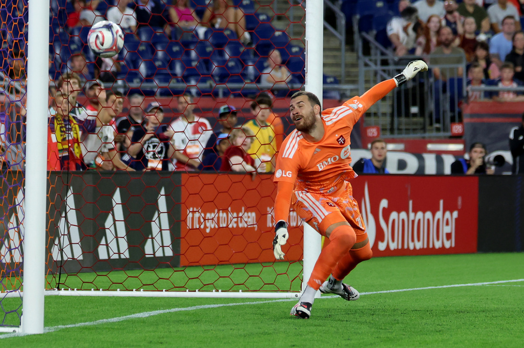 Toronto FC goalkeeper Luka Gavran deflects the ball from the net in the first half of an MLS soccer match against the New England Revolution, Wednesday, July 22, 2026, in Foxborough, Mass. (AP Photo/Mark Stockwell)