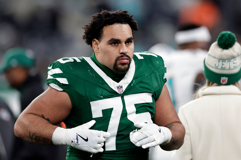 FILE - New York Jets guard Alijah Vera-Tucker reacts after an NFL football game against the Miami Dolphins on Jan. 5, 2025, in East Rutherford, N.J. (AP Photo/Adam Hunger, File)