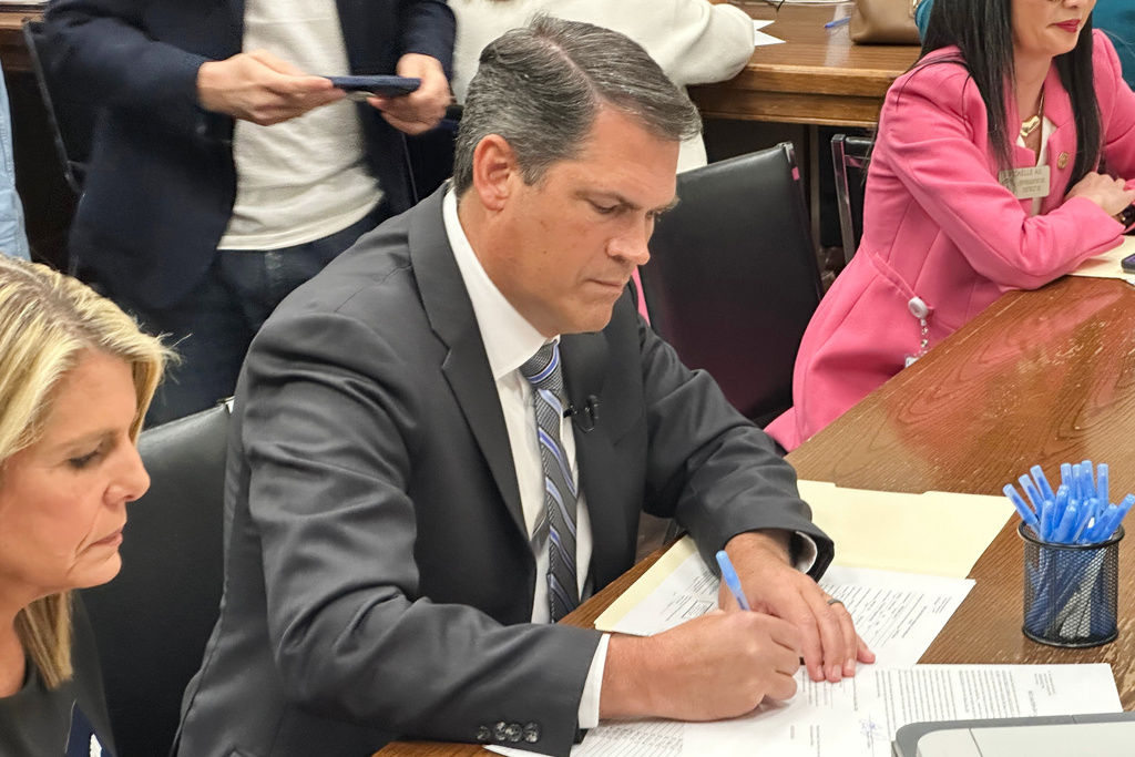 Democrat Geoff Duncan Jackson signs papers to qualify to run for governor, Tuesday, March 3, 2026, at the Georgia Capitol in Atlanta. (AP Photo/Jeff Amy)