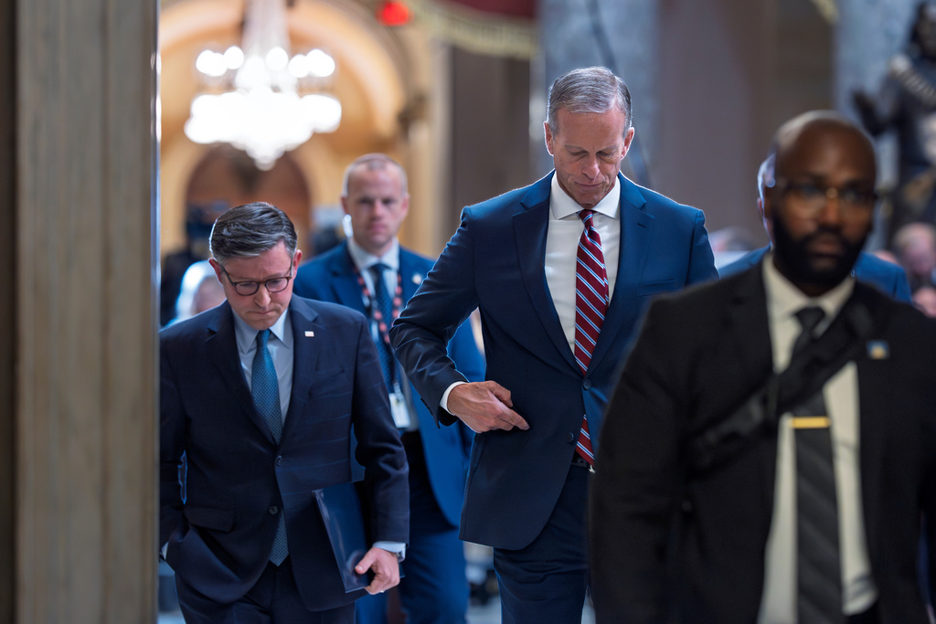 Speaker of the House Mike Johnson, R-La., left, and Senate Majority Leader John Thune, R-S.D., return to their offices after speaking with reporters on the third day of the government shutdown, at the Capitol in Washington, Friday, Oct. 3, 2025. (AP Photo/J. Scott Applewhite)
