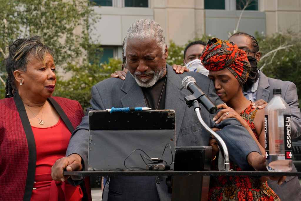 FILE - Joe Powell is comforted by his daughter, Nakia Porter, right, during a news conference to announce the filing of a federal lawsuit that has brought against two Solano County Sheriff's deputies, Wednesday, Aug. 18, 2021, in Sacramento, Calif. (AP Photo/Rich Pedroncelli,File)