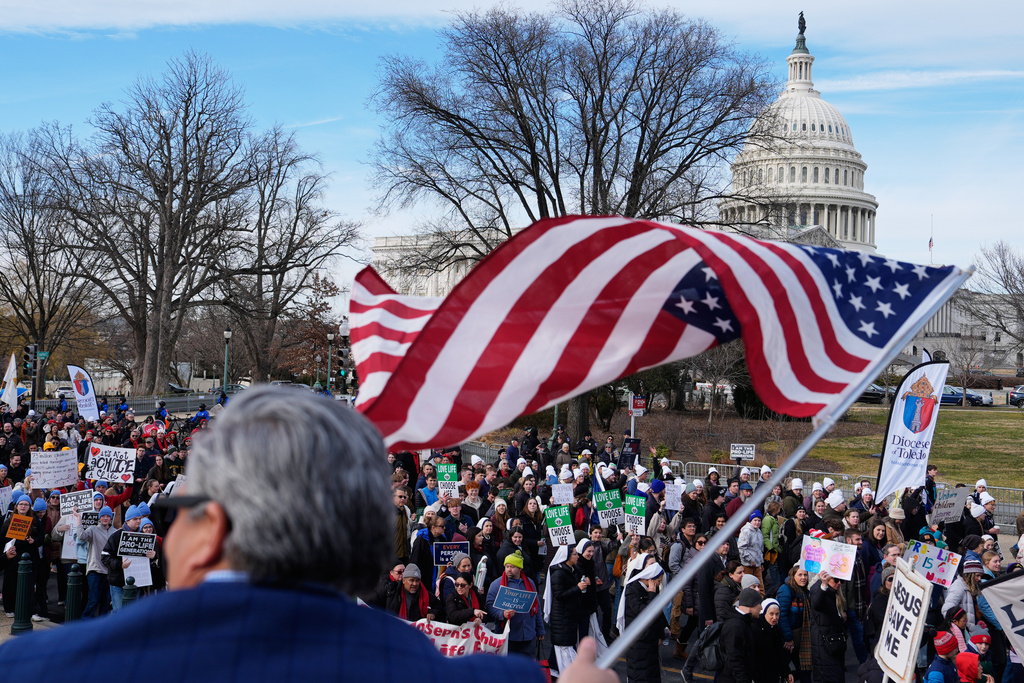 Anti-abortion demonstrators walk past the U.S. Capitol on their way to the Supreme Court during the annual March for Life, Friday, Jan. 23, 2026, in Washington. (AP Photo/Julia Demaree Nikhinson)