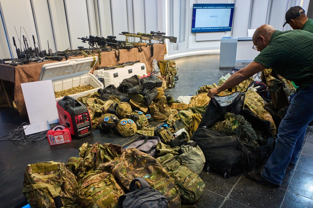 Weapons that Cuban authorities say were recovered from a speedboat in Cuban waters following a confrontation that left four people dead are displayed during a media presentation in Havana, Friday, Feb. 27, 2026. (AP Photo/Ramon Espinosa)
