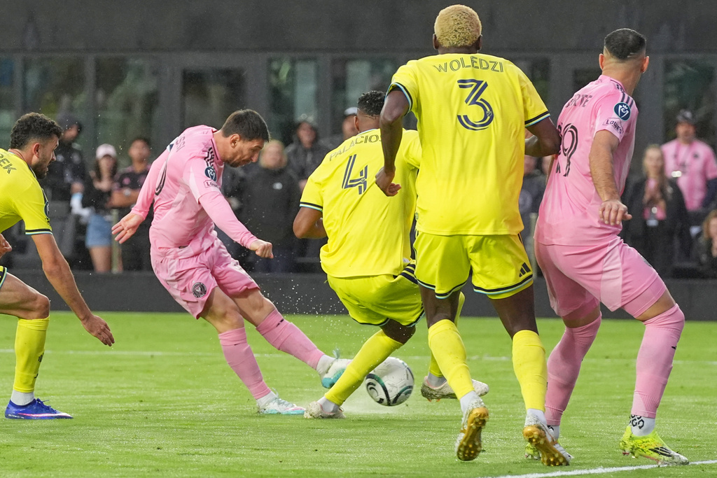 Inter Miami forward Lionel Messi (10) aims to score his 900th goal during a CONCACAF Champions Cup Round of 16 soccer match against Nashville, Wednesday, March 18, 2026, in Fort Lauderdale, Fla. (AP Photo/Marta Lavandier)