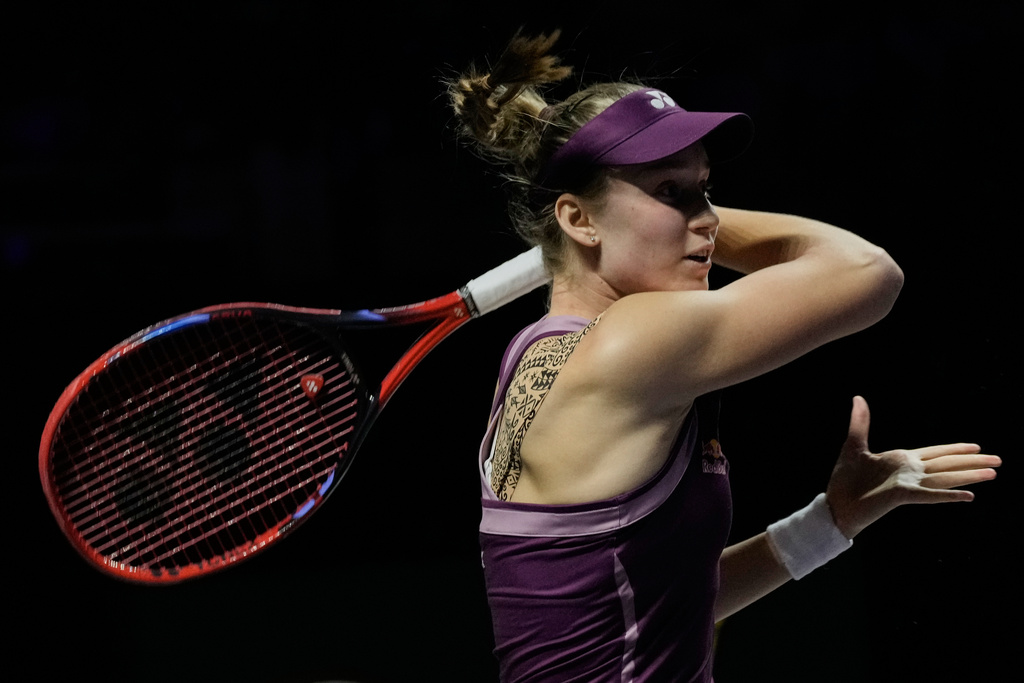 Elena Rybakina of Kazakhstan plays a forehand return to Jessica Pegula of the United States during their women's singles semifinal match at the WTA tennis finals in Riyadh, Saudi Arabia, Friday, Nov. 7, 2025. (AP Photo/Fatima Shbair)