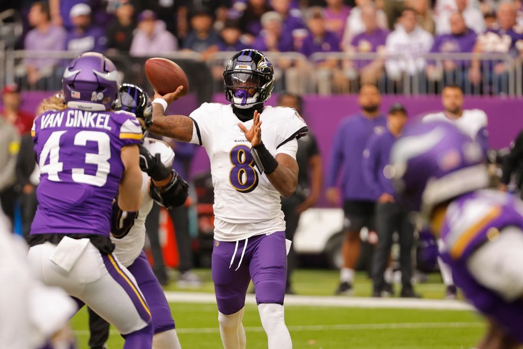 Baltimore Ravens quarterback Lamar Jackson (8)m passes against the Minnesota Vikings in the first half of an NFL football game, Sunday, Nov. 9, 2025, in Minneapolis. (AP Photo/Bruce Kluckhohn)