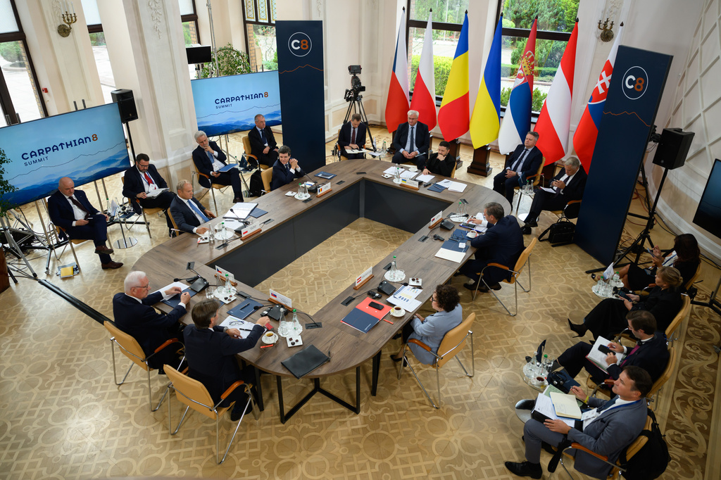 In this photo provided by the Ukrainian Presidential Press Office, Ukrainian President Volodymyr Zelenskyy, top center right, and EU officials attend a summit in a Carpathian 8 Summit in Bukovel, western Ukraine, Friday, Sept. 18, 2026. (Ukrainian Presidential Press Office via AP)